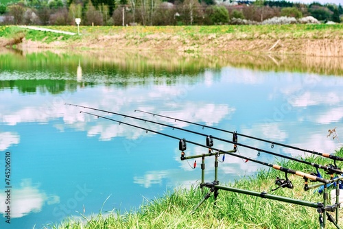 Obraz na płótnie Fishing on a beautiful spring lake w salonie