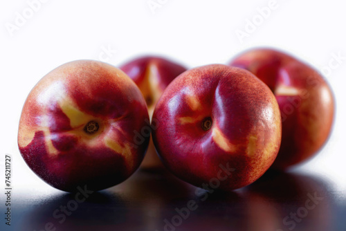 Pair of red yellow peaches white background, closeup view
