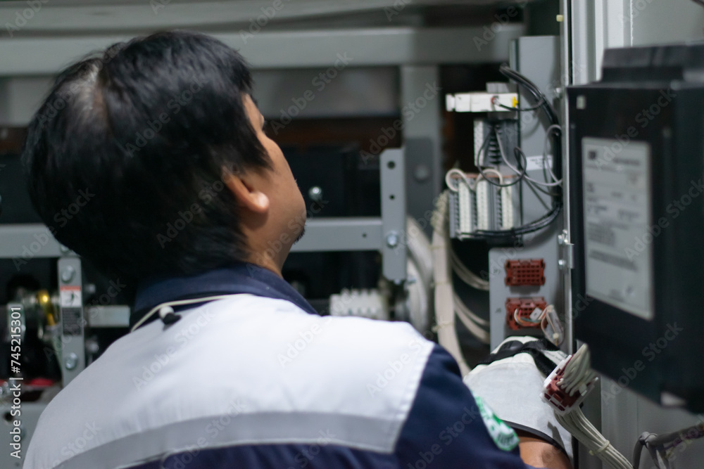 professional electrician checking power electrical system,preventive maintenance electricity in mdb room,technician service work mechanic at energy industry. professional electrician checking power electrical system,preventive maintenance electricity in mdb room,technician service work mechanic at energy industry.
