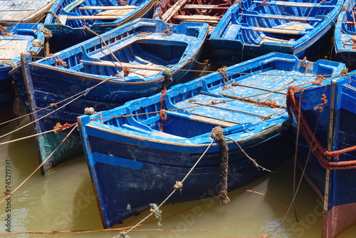 Famous fishing wooden blue boats of the Essaouira. Morocco. © Renar