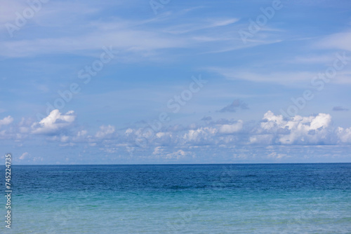Stunning beautiful sea landscape beach with turquoise water. Beautiful Sand beach with turquoise water. Beautiful tropical beach with blue sky and white clouds. © kanpisut