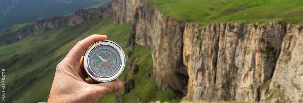 Naklejka premium On the ground compass with mountain view