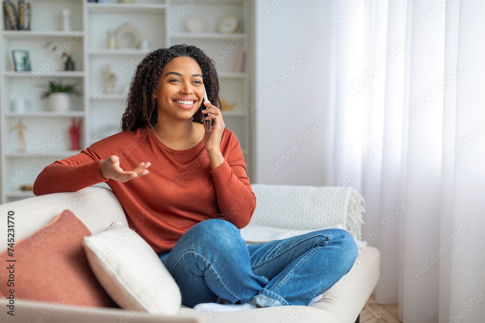Portrait Of Happy African American Woman Talking On Cellphone At Home Portrait Of Happy African American Woman Talking On Cellphone At Home