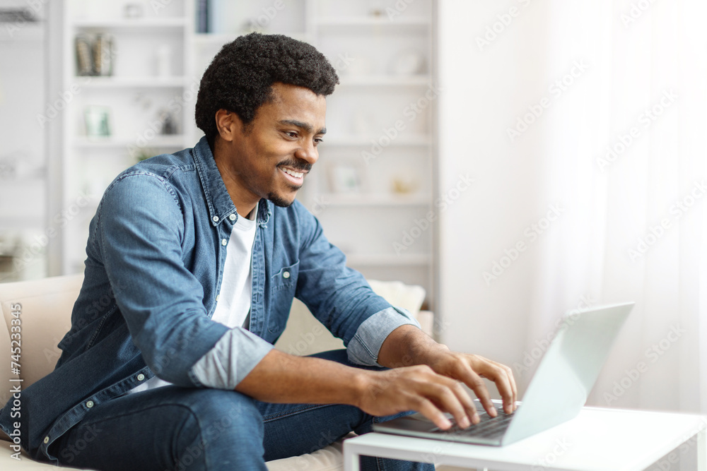 Remote Work. Smiling Black Male Freelancer Working With Laptop At Home Remote Work. Smiling Black Male Freelancer Working With Laptop At Home