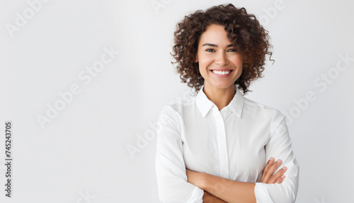 Young female professional. White background, copy space. Business Casual wearing white blouse. Natural look. Product advertising face testimonial. Happy smiling face. Advertising Campaign model.