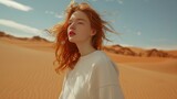 Redhead girl wearing crewneck white sweatshirt standing in the desert