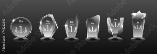 Elegant And Gleaming First-place Glass Trophy Cups With Laurel Engravings Stand In Row. Vector Symbols Of Triumph