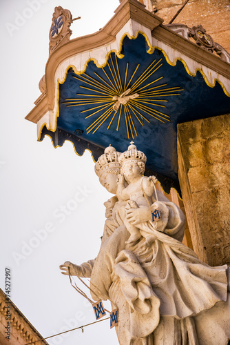Statue of the Madonna with child on the corner of the Church of the Annunciation