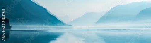 Morning mist over lake graient tranquil blue to softest white peaceful solitue photo