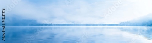 Morning mist over lake graient tranquil blue to softest white peaceful solitue