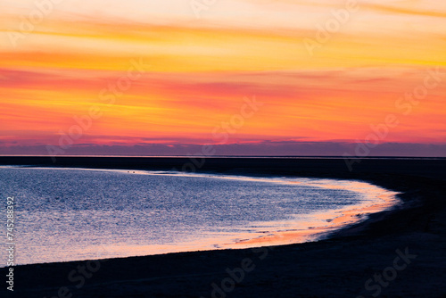 red sunset over blue sea © Melinda Nagy