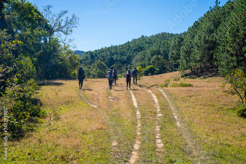 Ta Nang - Phan Dung route with milestone between 3 provinces through grass hills and forests in Song Mao Nature Reserve