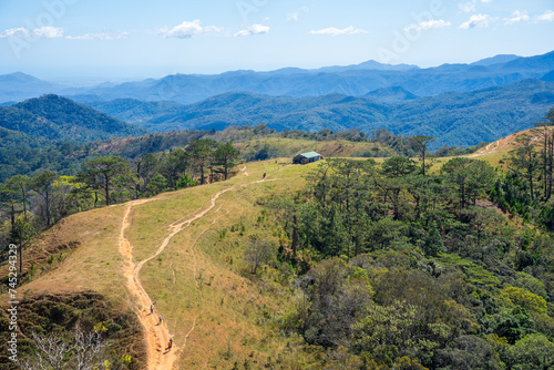 Ta Nang - Phan Dung route with milestone between 3 provinces through grass hills and forests in Song Mao Nature Reserve