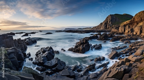 A panoramic view of the rocks and the water on the coast