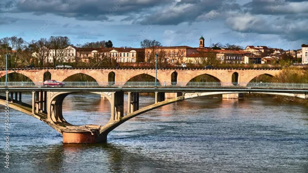 New Bridge and Old Bridge over Tarn River in Montauban. Montauban is commune in Tarn-et-Garonne department in Occitanie region in southern France. New Bridge and Old Bridge over Tarn River in Montauban. Montauban is commune in Tarn-et-Garonne department in Occitanie region in southern France.