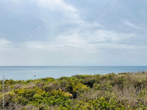 Rocky coastline, ocean horizon, rocks at the ocean, cliffs photo