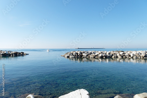 View from the coast of Livorno with the breakwater Diga della Vegliaia . Tuscany, Italy