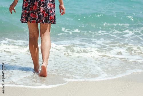 A Feet and footprints by the seashore in nature travel vacation background © Kostia