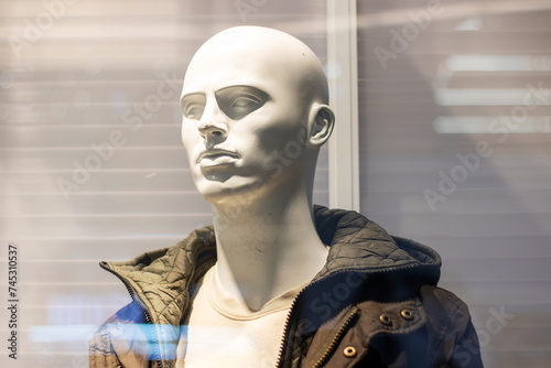Male mannequin in blue jacket close up