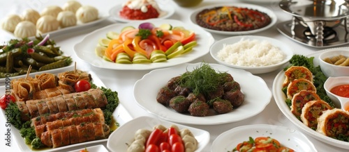 The image showcases a table filled with various plates of authentic Turkish cuisine, including kebabs, mezes, baklava, and more. The colorful dishes are neatly arranged, highlighting the rich flavors