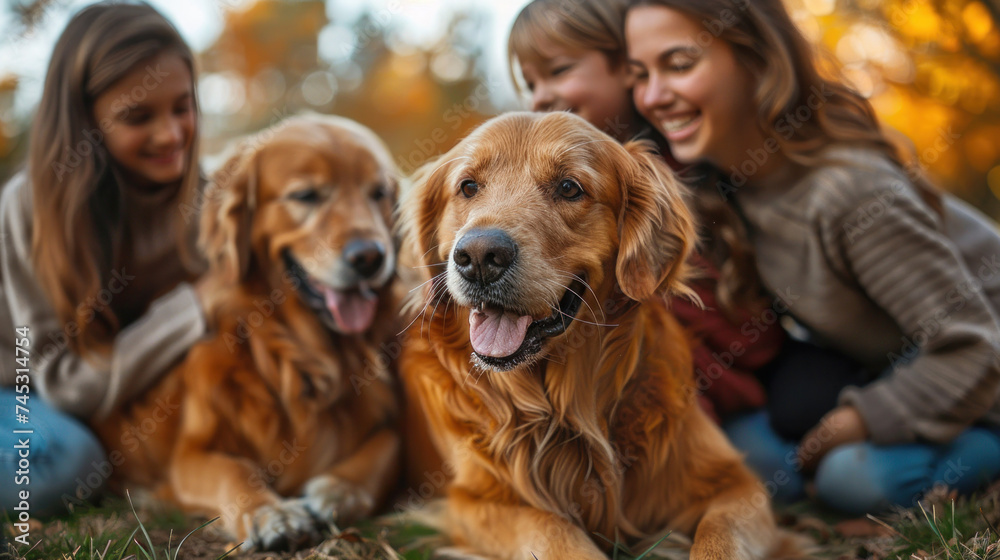 happy family playing with a golden retriever dog on the backyard lawn. happy family playing with a golden retriever dog on the backyard lawn.