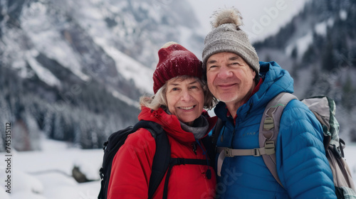 Portrait cheerful smiling middle age woman hiking walking with her husband enjoying free time and nature. Active beautiful seniors in love together at winter day