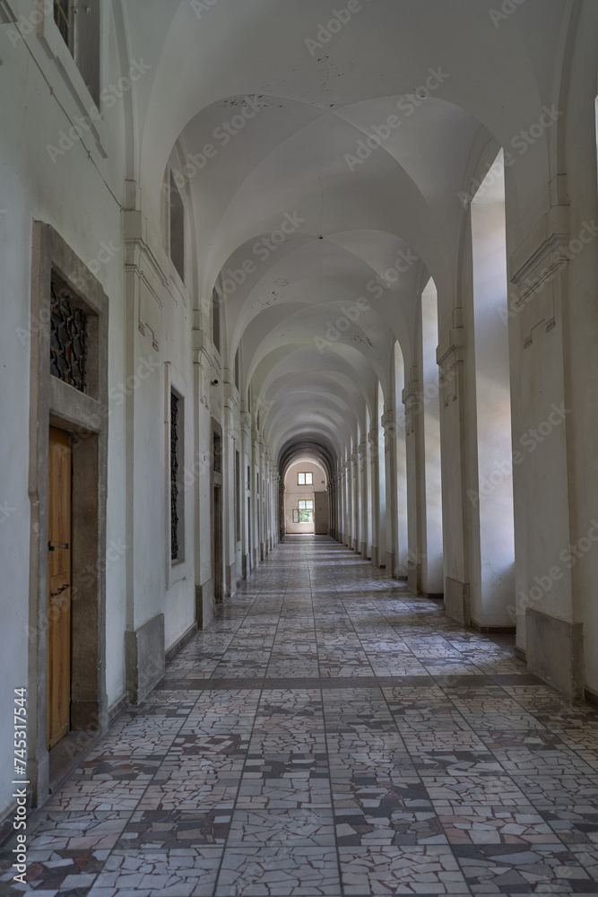 Prague, Czech Republic — June 17, 2023 - Long hallway of Invalidovna — baroque building for war veterans