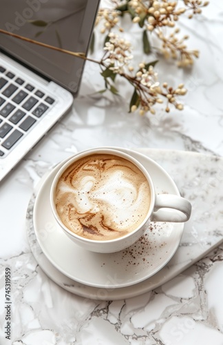 coffee on a white plate with laptop and mug