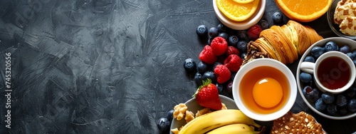 a table topped with fruit and a cup of tea