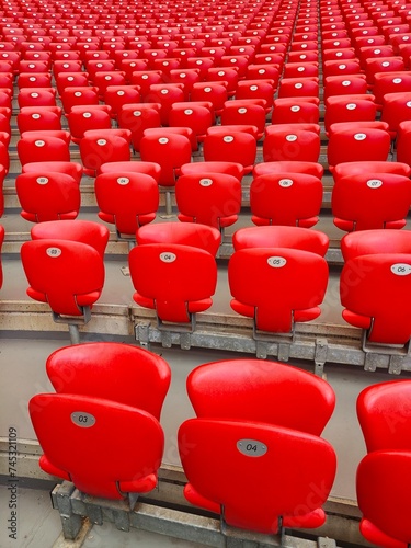 Close-up view of red seats in a stadium