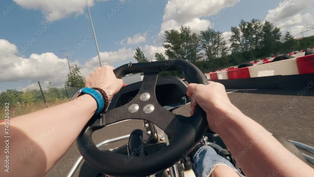 Go kart race driving by girl, carting outdoors, first person view