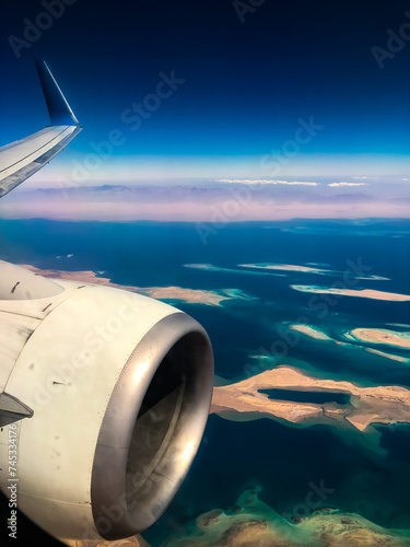 Aerial top view from airplane coastline Egyptian Desert islands
