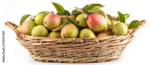 A basket overflowing with ripe green and red fruits, including juicy guavas, set against a white background. The fruits are fresh and vibrant, ready to be enjoyed.