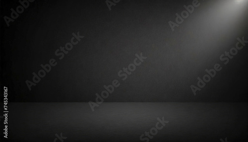 Black wall mockup with texture. The light from the lamp falls from the top right and illuminates the wall