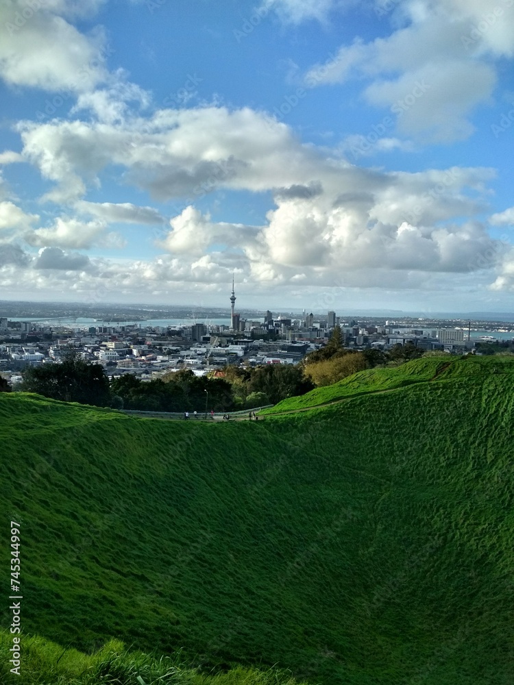  Mount Eden (Maungawhau) volcano crater in Auckland, New Zealand with panoramic view of Auckland