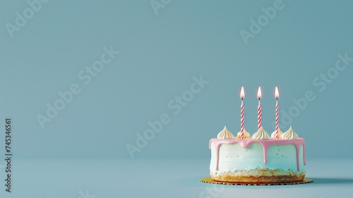 sweet birthday cake with candles on pastel blue background with copy space