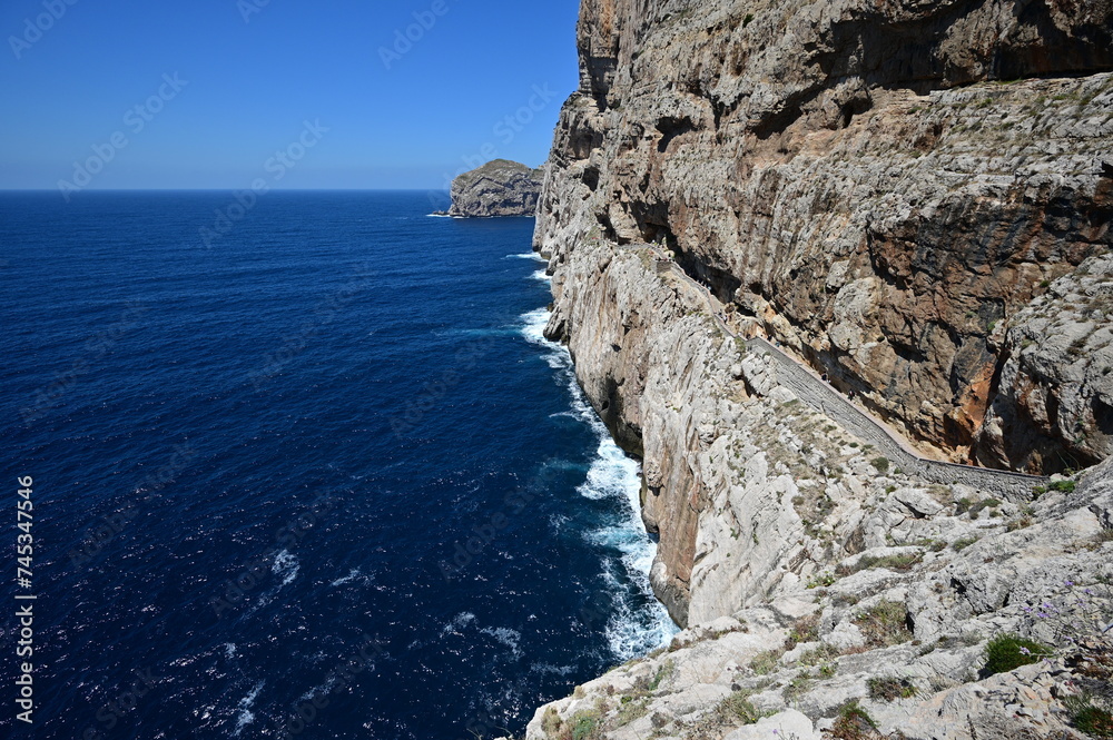 A stairway called Escala del Cabirol, cut into the cliff, leads from the top of the cliff at Capo Caccia down to the entrance to Neptune's Grotto
