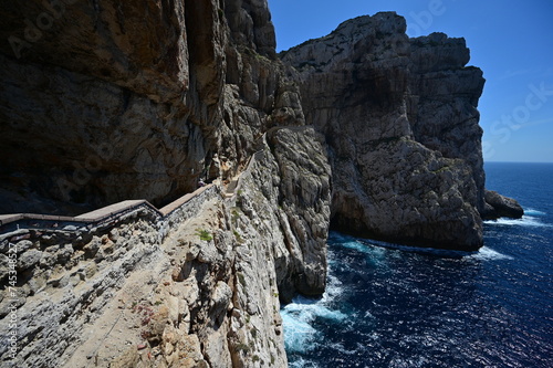 A stairway called Escala del Cabirol, cut into the cliff, leads from the top of the cliff at Capo Caccia down to the entrance to Neptune's Grotto 