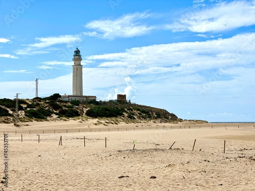 Faro de Trafalgar, view of the lighthouse at a sandy headland with dunes between Los Caños de Meca and Zahora, Conil de la Frontera, Vejer de la Frontera, Costa de la Luz, Andalusia, Spain © keBu.Medien