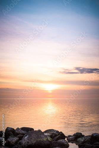 Fototapeta Naklejka Na Ścianę i Meble -  Colorful Sunsets over water
