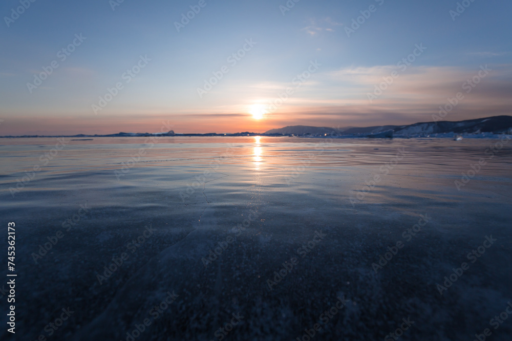Fototapeta premium Gas methane bubbles frozen in blue ice of lake Baikal