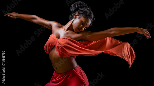 Curly hair black woman in a red dress are dancing and feeling free
