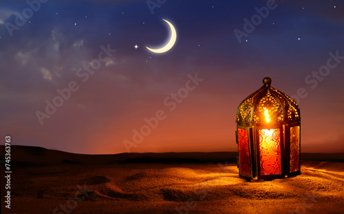 Colorful Ramadan lantern on desert dunes. Islamic greeting Eid Mubarak cards for Muslim Holidays. Crescent moon and stars.