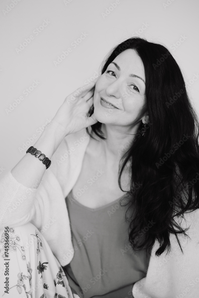A black and white picture of a Serene mature woman, black hair, embodies grace amidst midlife change. for narratives on navigating menopause with positivity, and hormonal changes. A black and white picture of a Serene mature woman, black hair, embodies grace amidst midlife change. for narratives on navigating menopause with positivity, and hormonal changes.