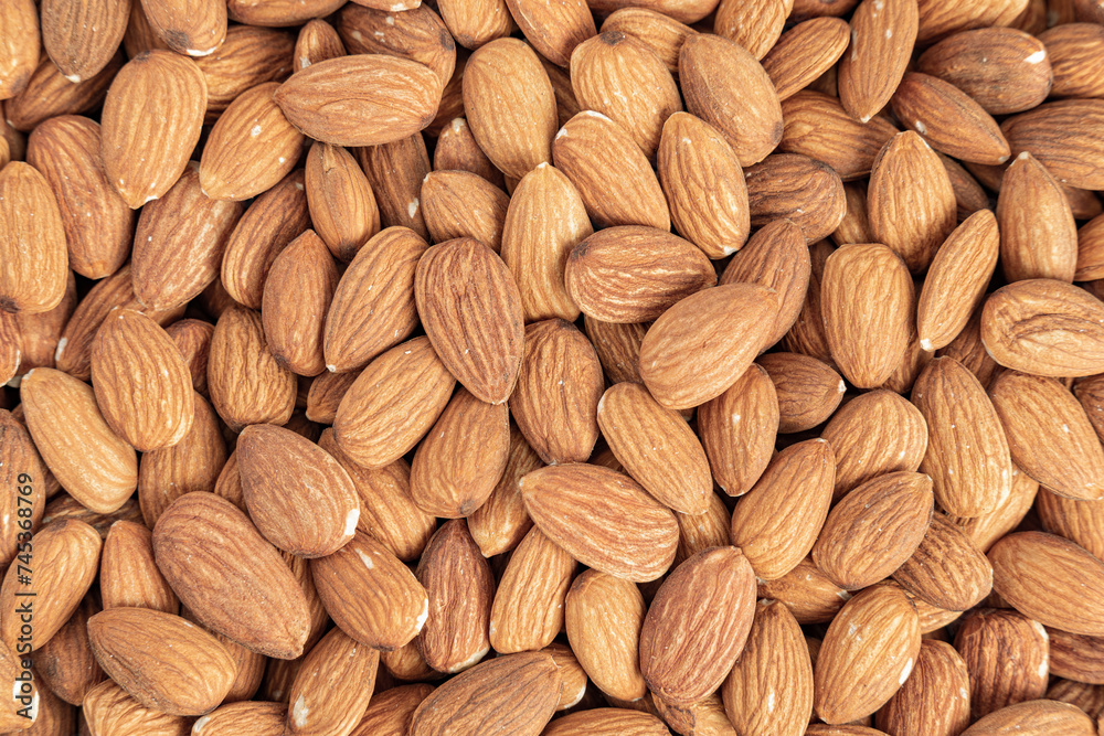 Close up with many fresh organic peeled almonds . Natural texture background. Close up with many fresh organic peeled almonds . Natural texture background.