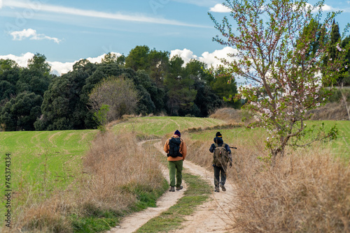 Two hikers walking on a beautiful path
