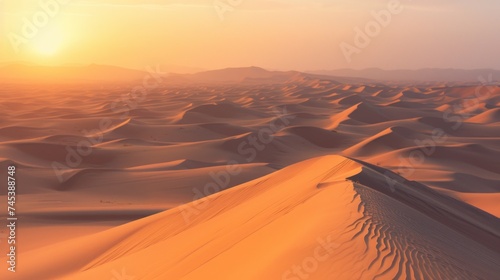 the sun is setting in the desert with a sand dune in the foreground and mountains in the far distance.