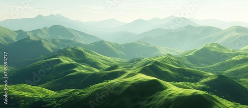 This aerial view showcases a vast mountain range surrounded by lush green hills. The landscape is stunning and captures the beauty of nature from above.