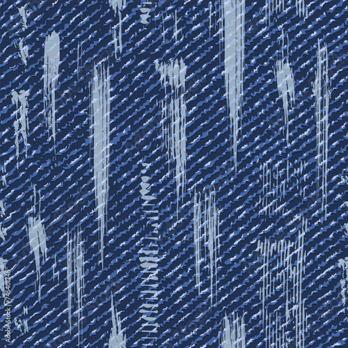 Seamless blue denim pattern with vertical paint brush strokes, blots, spattered paint. Random composition. Grunge style