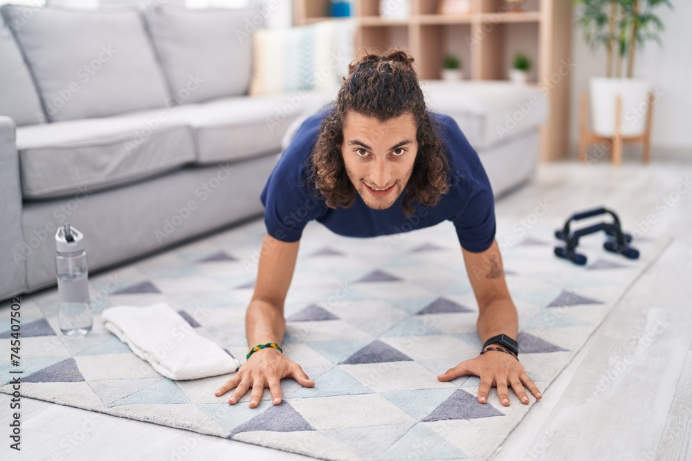 Young hispanic man smiling confident doing yoga exercise at home Young hispanic man smiling confident doing yoga exercise at home